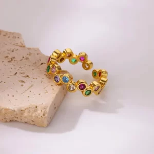 ANILLO "CONFETTI" CON ZIRCONIAS EN ACERO INOXIDANLE DORADO