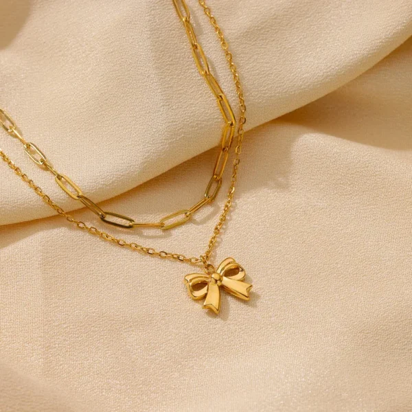 Collar "Moño"con doble cadena en Acero Inoxidable Dorado