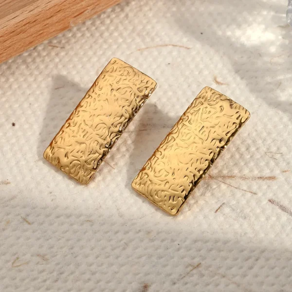 Aretes " Pergamino" en Acero Inoxidable Dorado