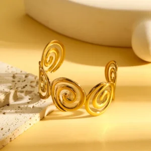 Brazalete “Swirl” en Acero Inoxidable Dorado