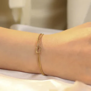Pulsera "Knot Mini " en Aceor Inoxidable y Chapado en Oro de 18K
